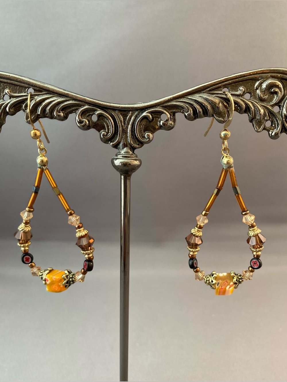 Yellow, brown beads and crystals gold tone metal loop dangle hanging earrings